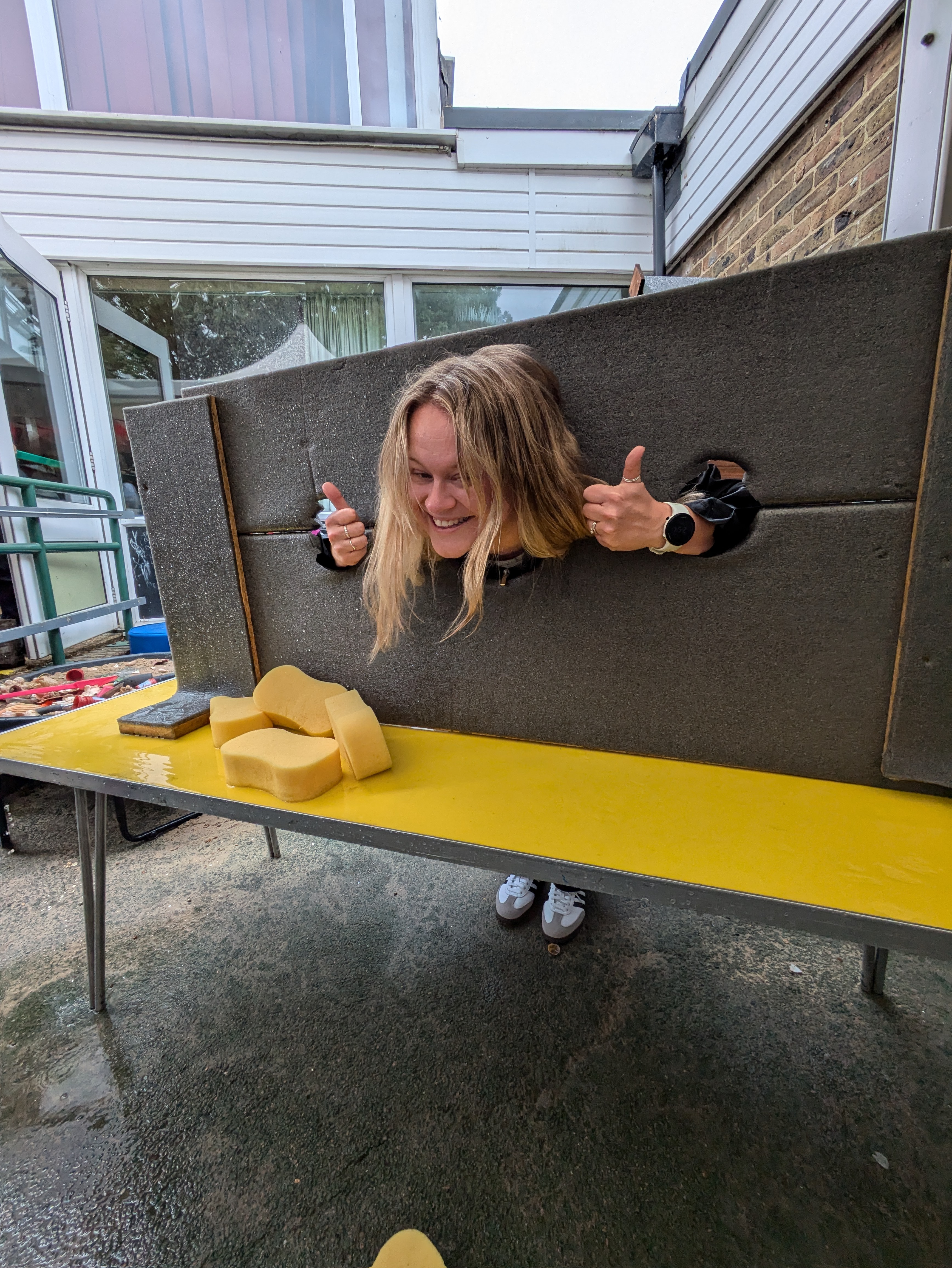 A teacher volunteering in the stocks
